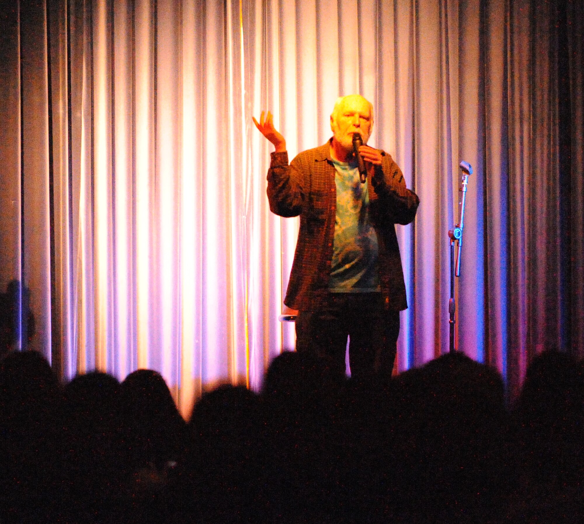 John Basinger aka Honest John, a comedian from Los Angeles entertains Airmen and their families April 22, 2011 at Incirlik Air Base, Turkey.  Honest John provided plenty of laughs and boosted the morale of Airmen.  The comedy show was sponsored by the 39th Force Support Squadron. (U.S. Air Force Photo by Tech. Sgt. Valda Wilson/released)