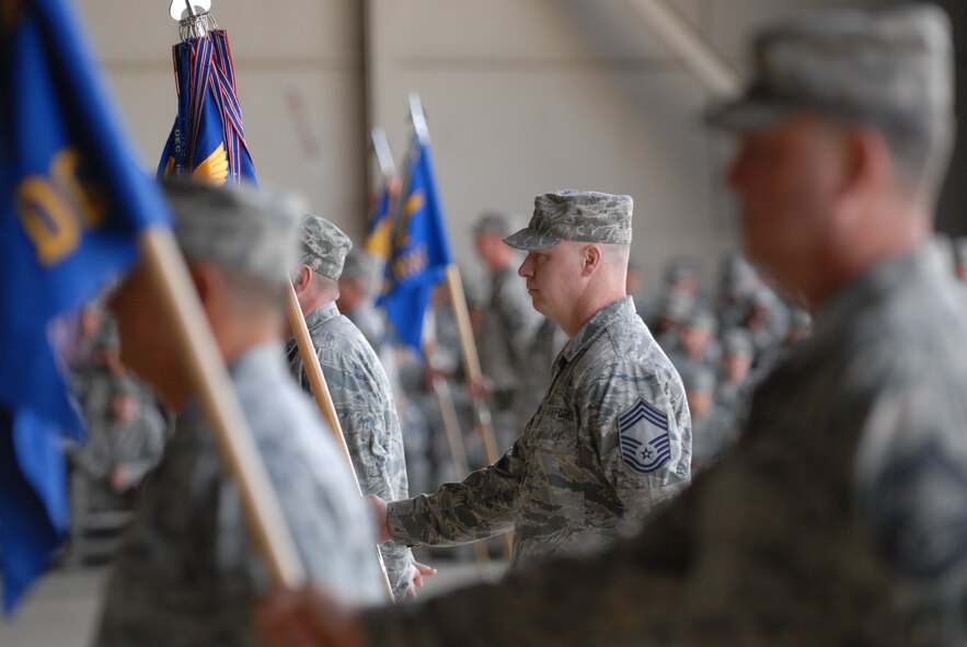 KUNSAN AIR BASE, Republic of Korea – Chief Master Sgt. Dudley Baker, 8th Mission Support Group superintendent, stands at parade rest with his group guidon during the 8th Fighter Wing change of command ceremony here May 13.  (U.S. Air Force photo/Master Sgt. Sonny Cohrs)