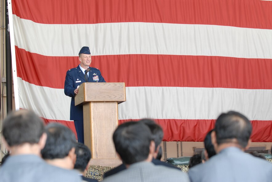 KUNSAN AIR BASE, Republic of Korea -- Col. John Dolan, former 8th Fighter Wing commander, thanks all Wolf Pack members, including the wing’s Korean counterparts for their hard work and dedication to excellence over the last year during the wing change of command ceremony in Hangar 3 here May 13. (U.S. Air Force photo/Senior Airman Benjamin Stratton)