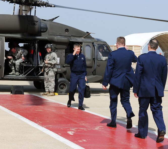 KUNSAN AIR BASE, Republic of Korea -- Col. John Dolan, former 8th Fighter Wing commander, and Col. Scott Pleus, 8th FW commander,  greets Lt. Gen. Jeffrey Remington, 7th Air Force commander, here May 13. General Remington was the presiding official during the 8th FW change of command ceremony. (U.S. Air Force photo/Senior Airman Brittany Y. Bateman)
