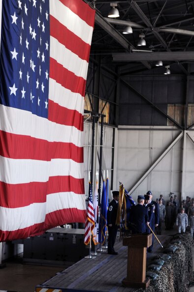 KUNSAN AIR BASE, Republic of Korea -- Col. Scott Pleus, 8th Fighter Wing commander, accepts the flag from Lt. Gen. Jeffrey Remington, during the 8th FW change of command ceremony here May 13. General Remington is the Deputy Commander, United Nations Command Korea; Deputy Commander, U.S. Forces Korea; Commander, Air Component Command, Republic of Korea; U.S. Combined Forces Command; and 7th Air Force commander. (U.S. Air Force photo/Senior Airman Brittany Y. Bateman)