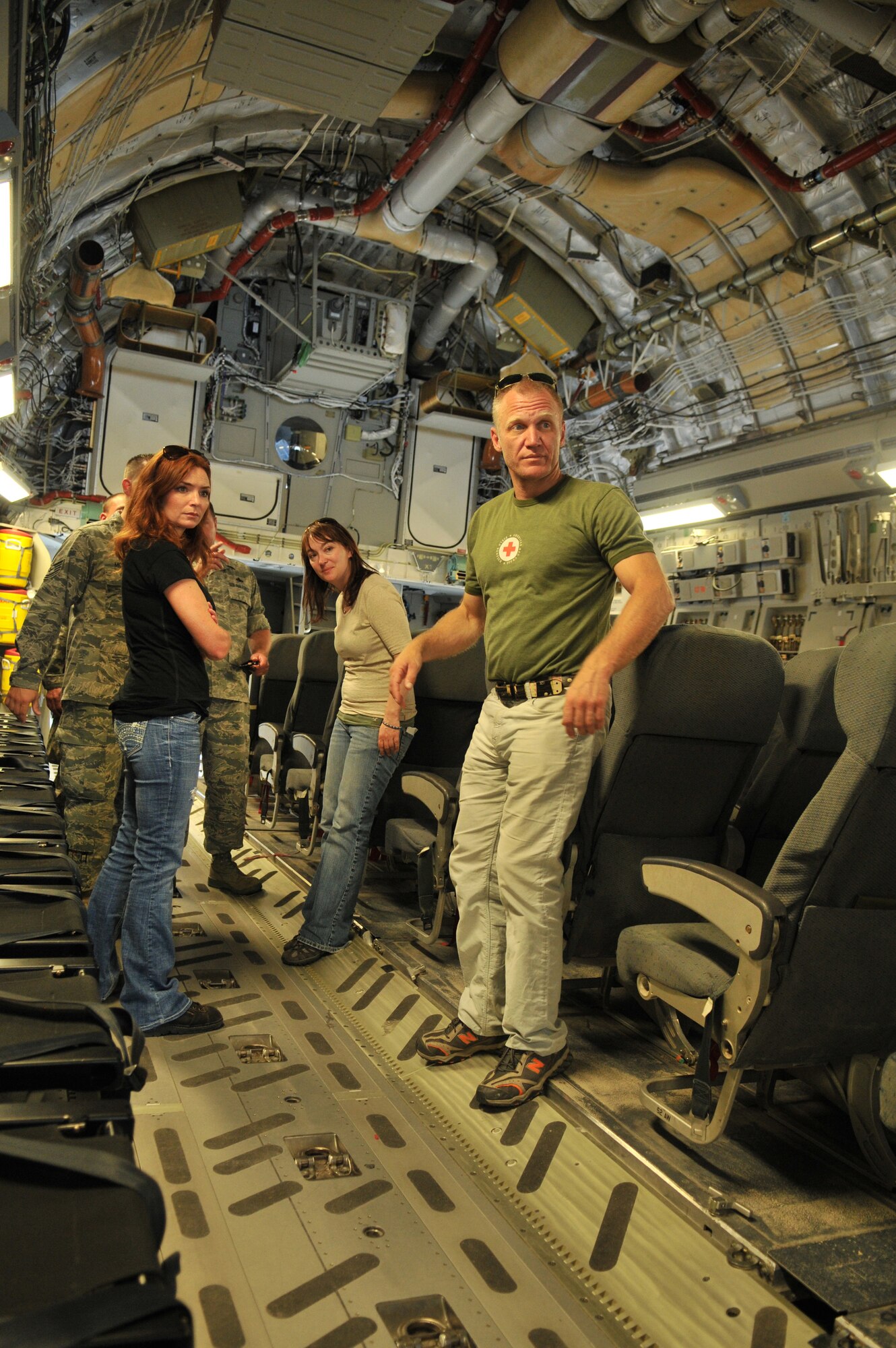 TRANSIT CENTER AT MANAS, Kyrgyzstan -- Brigid Brannagh and Terry Serpico, actors from the show Army Wives, visit the Transit Center as a part of an Armed Forces Entertainment tour on May 12.  Brigit and Terry took a tour of Security Forces, Explosive Ordnance Disposal, a KC-135 Stratotanker and a C-17 Globemaster III. Later in the evening they were able to talk to the troops and sign autographs. (U.S. Air Force photo/Staff Sgt. Stacy Moless)
