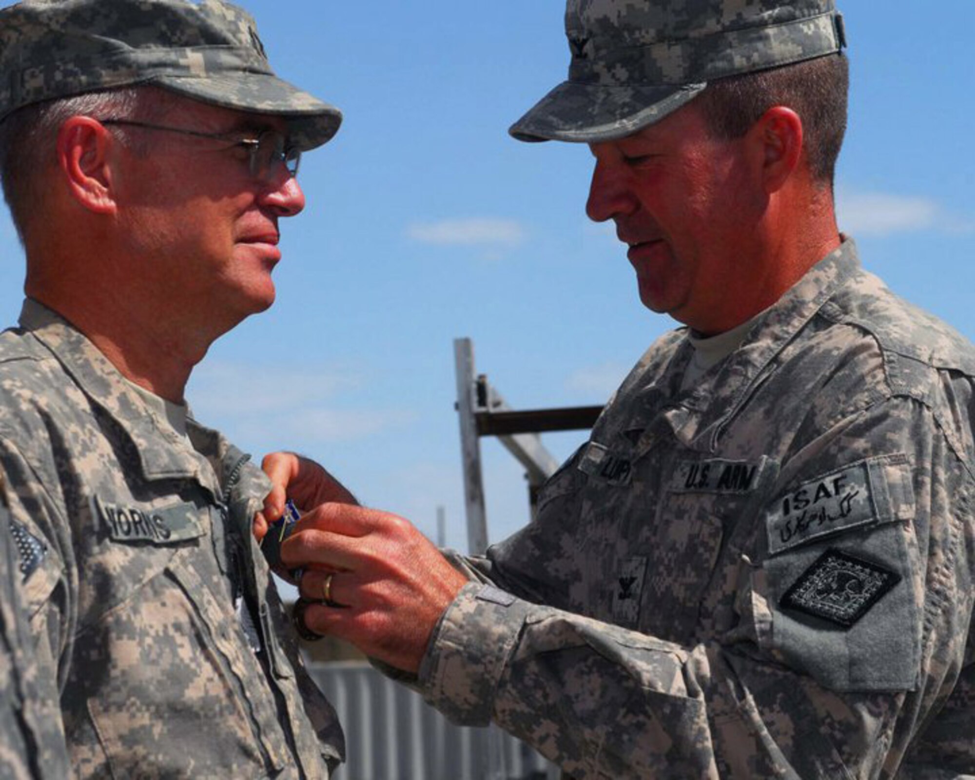 Colonel Paul Norris receives the NATO International Security Assistance Force (ISAF) Medal from Arkansas National Guard Agricultural Development Team 2 commander, Col. Mark Lumpkin, in Afghanistan. Colonel Norris along with 60 members of the Arkansas National Guard is currently deployed as part of the ADT 2. Colonel Norris is the 188th Fighter Wing Medical Group commander. (US Army photo by Sgt. Mike Brinson/ADT 2 public affairs)