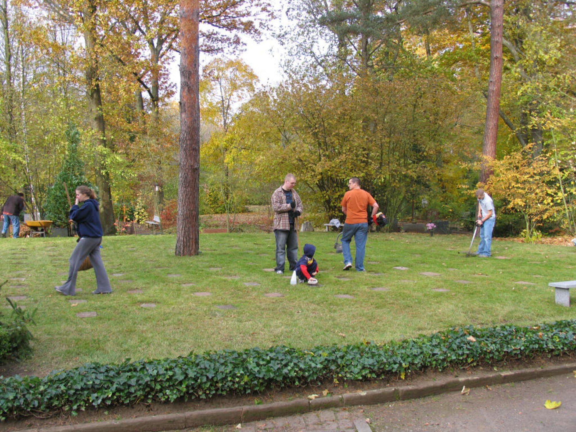 Members of the German-American and International Women’s Club and the  Ramstein Area Chiefs' Group take care of the kindergraves at the Kaiserslautern Waldfriedhof, where a mermorial service will be held 10 a.m. on May 14.