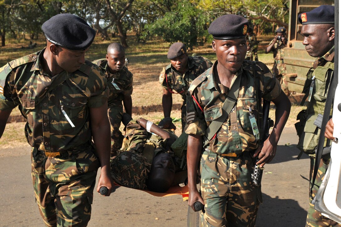 Malawi Defense Force medics apply combat lifesaving skills taught by U.S. Army soldiers during a field training exercise at MEDREACH 11 in Lilongwe, Malawi, May 12, 2011. The soldiers are assigned to the Army Reserve’s 399th Combat Support Hospital.
