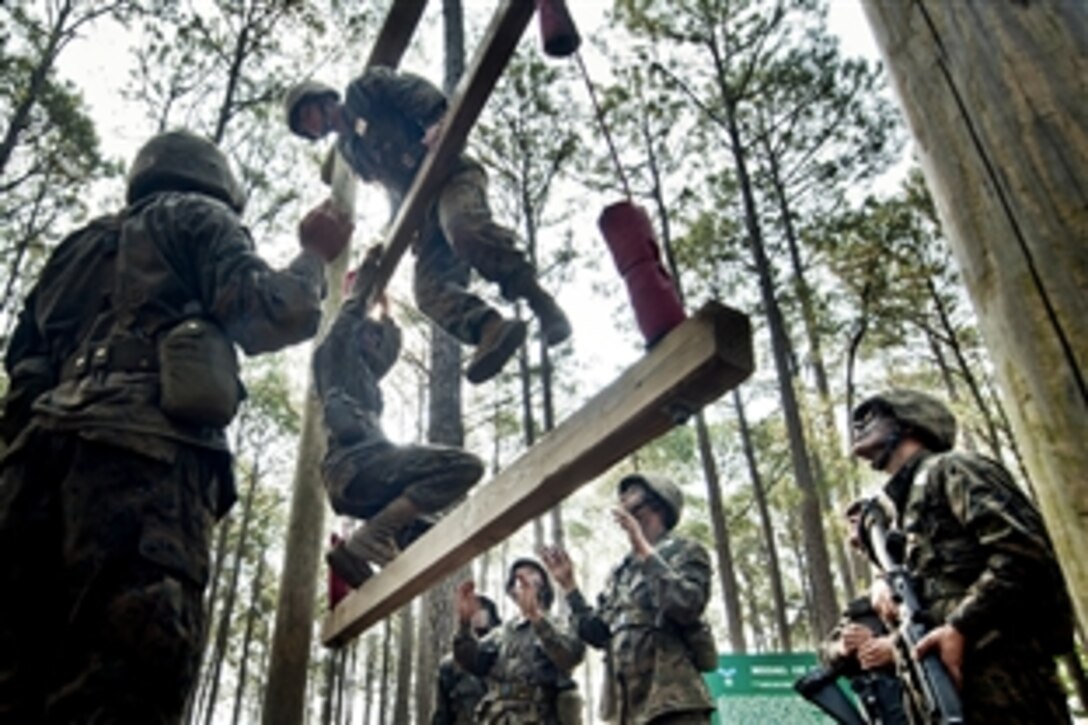 U.S. Marine recruits work as a team to overcome an obstacle in The Crucible, the final field exercise, at Parris Island, S.C., May 13, 2011. 