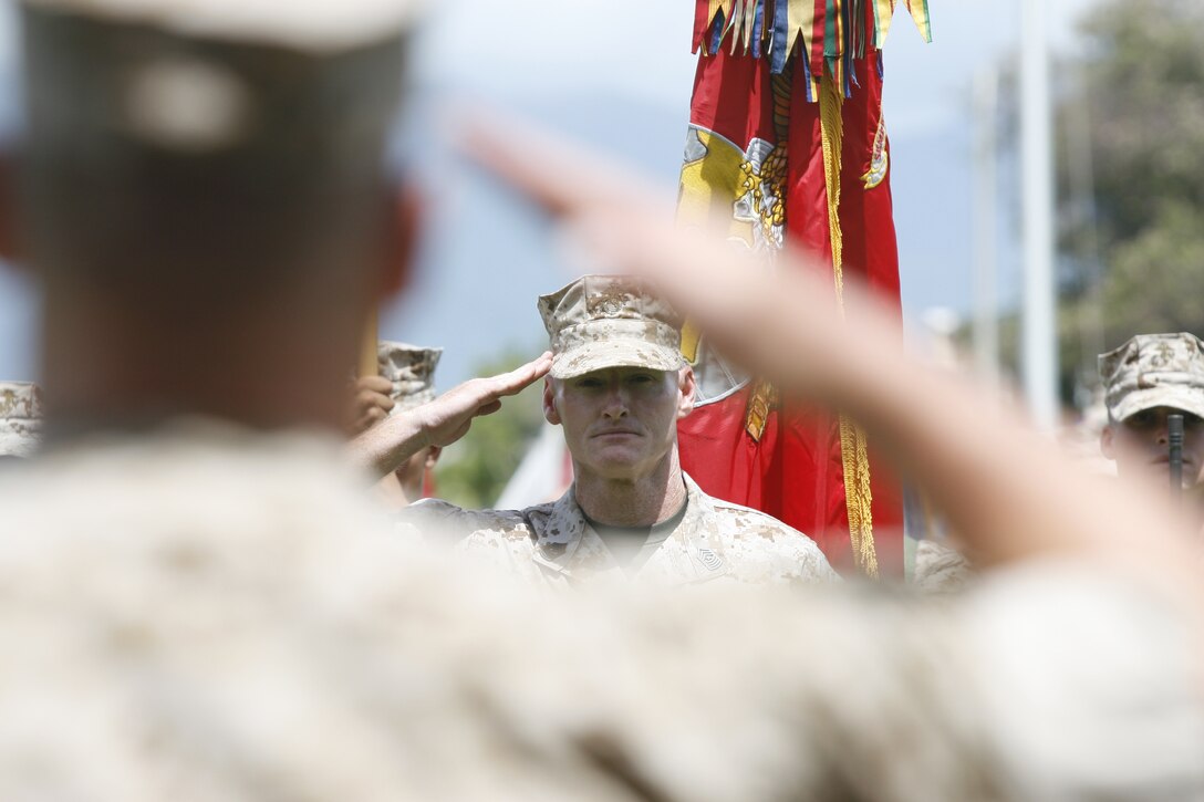 Sgt. Maj. Paul G. McKenna, outgoing sergeant major of 3rd Marine Regiment, salutes before relinquishing his post during a post and relief ceremony at Marine Corps Base Hawaii, May 13, 2011.  Sgt. Maj. Justin D. LeHew replaced McKenna as the regiment’s senior enlisted advisor.  (U.S. Marine Corps photo by Lance Cpl. Jody Lee Smith/Released)