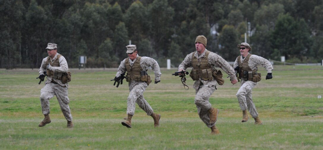 PUCKAPUNYAL, Australia - U.S. Marines stationed at Quantico, Va., Kaneohe Bay, HI, and Okinawa, Japan participate in the falling plate competition during the the 2011 Australian Army Skill at Arms Meeting (AASAM) May 15. The week-long meeting pits representatives from partner-nations in competition in a grueling series of combat marksmanship events. Represented nations include Canada, France (French Forces New Caledonia), Indonesia, Timor Leste, Brunei, Netherlands, US Marines, Papua New Guinea, New Zealand, Singapore, Malaysia, Thailand and a contingent of Japanese observers. The AASAM is designed to pit the best soldiers against each other in a tough combat-like environment. Since 1984, AASAM has been Australia's premier military shooting tournament.