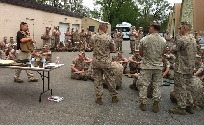 Carlos Jaramillo, a Program Manager Infantry Combat Equipment (PM ICE) Training Team East member who works out of Camp Lejeune, N.C., demonstrates body armor with Reserve Infantry Marines of 1st Battalion, 24th Marines, in Grand Rapids, Mich. (PM ICE photo)