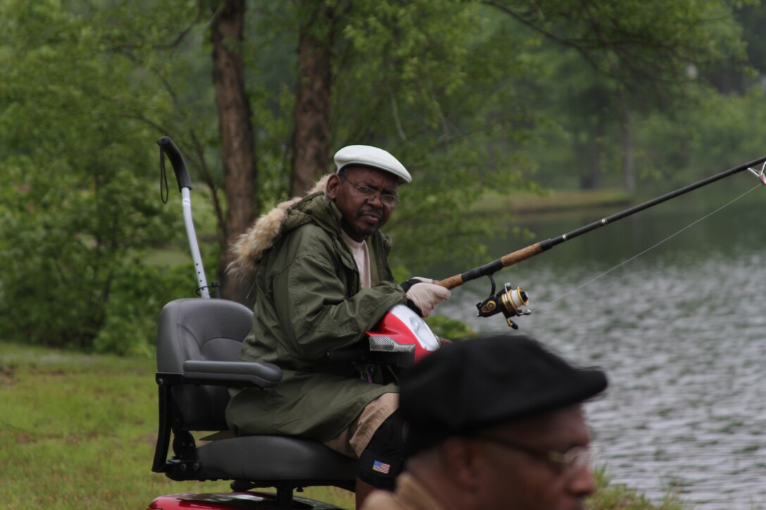 Vic McCarley, a former U.S. Army soldier from Lattimore N.C., casts a line into Lunga Reservoir during the Quantico Rod and Gun Club’s annual Wounded Veteran Picnic May 14. Veterans at the picnic were provided fishing poles and tackle by Project Healing Waters Fly Fishing, an organization dedicated to teaching and providing opportunities to fish to wounded warriors.