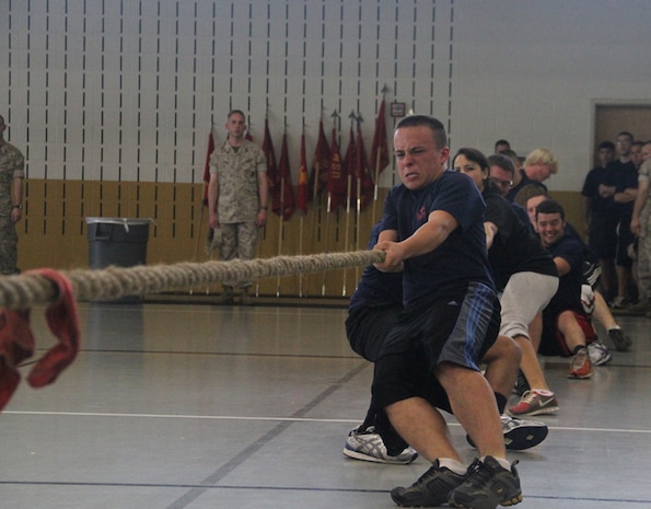 Enlistees from Recruiting Station Indianapolis, Ind., pull on a rope for the tug-o-war portion of the State Wide competion May 14, 2011. The State Wide is a annual competition between the sub-stations of RS Indianapolis.