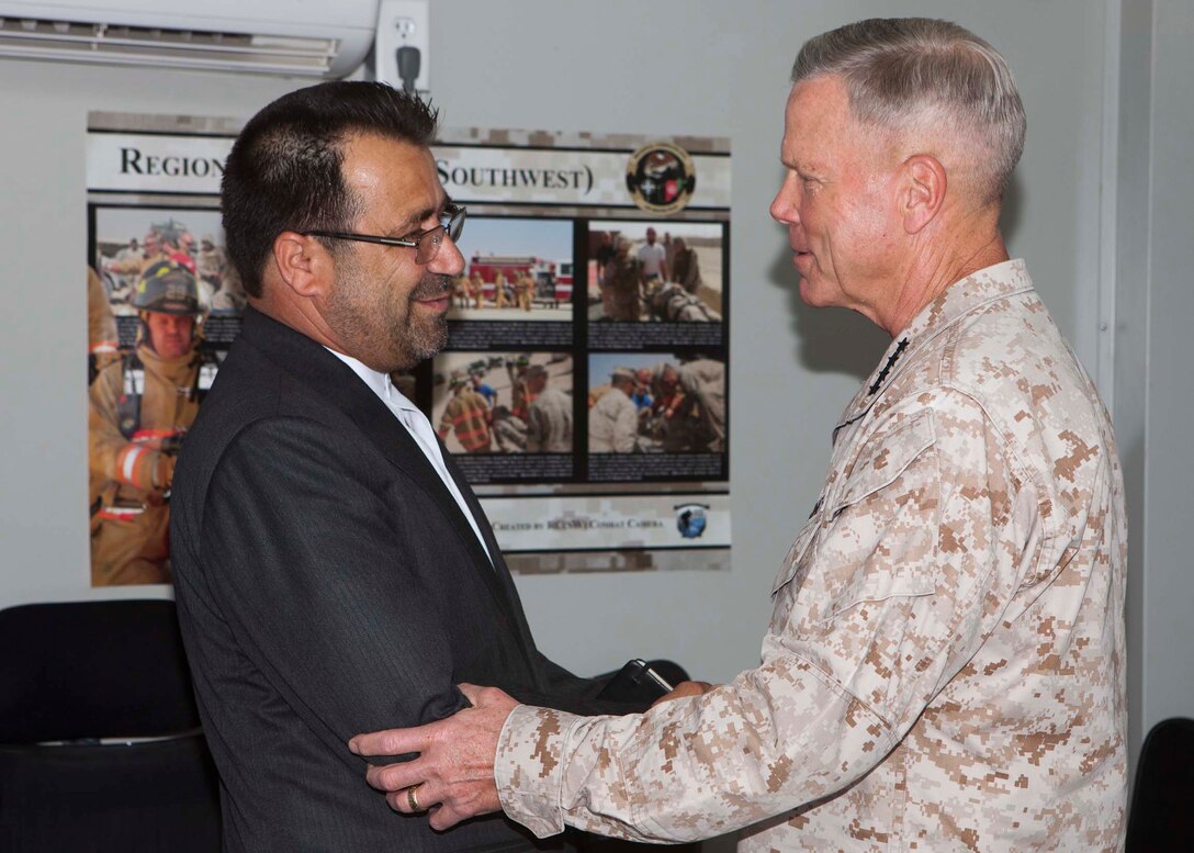 U.S. Marine Corps General James F. Amos, Commandant of the Marine Corps, and U.S. Marine Corps Sergeant Major Carlton Kent, Sergeant Major of the Marine Corps, host a dinner for Mohammad Gulab Mangal, governor of the Helmand Province, Afghanistan, and other military and Afghan National leaders in the Regional  Command (Southwest) compound at Camp Leatherneck, Afghanistan, May 14, 2011. General Amos and Sergeant Major Kent traveled from Marine Corps Headquarters in Washington D.C. to visit Marines deployed to forward operating bases in the Helmand province.