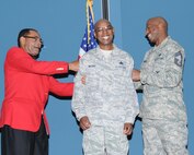 Retired Command Chief Master Sgt. Thomas Smith (left) and Chief Gordon Caviness pin the 916th newest Chief Master Sgt. Terry McCabe during a ceremony held on May 14, 2011. (USAF photo by SSgt. Terrica Jones, 916ARW/PA)