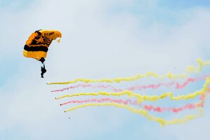 A member of the Army Golden Knights Parachute Team, prepares to land after completing a aerial jump during the AirPower Over Hampton Roads Open House at Langley Air Force Base, Va., May 14, 2011. The Golden Knights have been wowing audiences at air shows, competitions, and high-profile tandems for 50 years. (U.S. Air Force photo by Airman 1st Class Kayla Newman)(RELEASED)