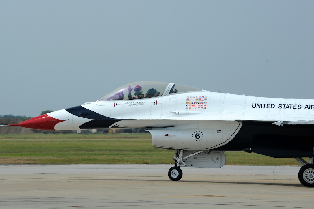 Maj J.R. Williams, U.S. Air Force Demonstration Squadron , Thunderbirds pilot, waves to the crowd during the AirPower Over Hampton Roads Open House at Langley Air Force Base, Va., May 14, 2011. The U.S. Air Force Thunderbirds display the most advanced airpower and support capabilities in the world at Airpower over Hampton Roads. (U.S. Air Force photo by Airman 1st Class Kayla Newman)(RELEASED)
