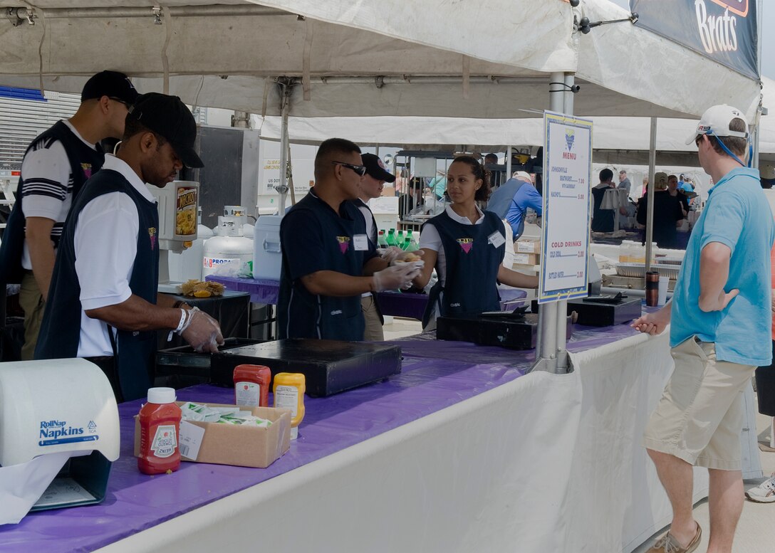 Langley Airmen work at concessions during AirPower over Hampton Roads May 14, 2011. The annual open house provides a free venue in which the public can see modern and historical military aircraft and civilian performers in action. (U.S. Air Force photo/Senior Airman Zachary Wolf)(RELEASED)