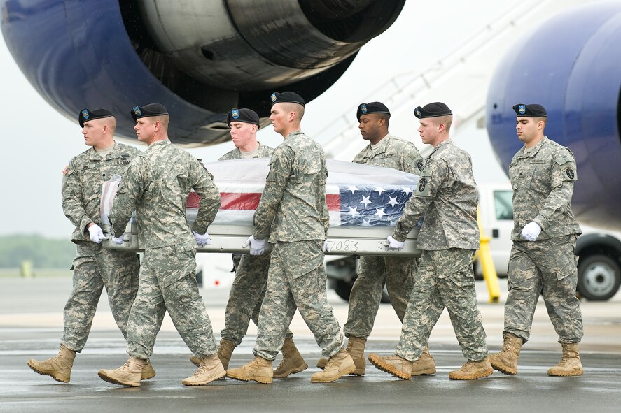 A U.S. Army carry team transfers the remains of Army Sgt. Amaru Aguilar, of Miami, Fla., at Dover Air Force Base, Del., May 14, 2011. Aguilar was assigned to the 4th Battalion, 4th Cavalry Regiment, 1st Brigade Combat Team, Fort Riley, Kan. (U.S. Air Force photo/Roland Balik)