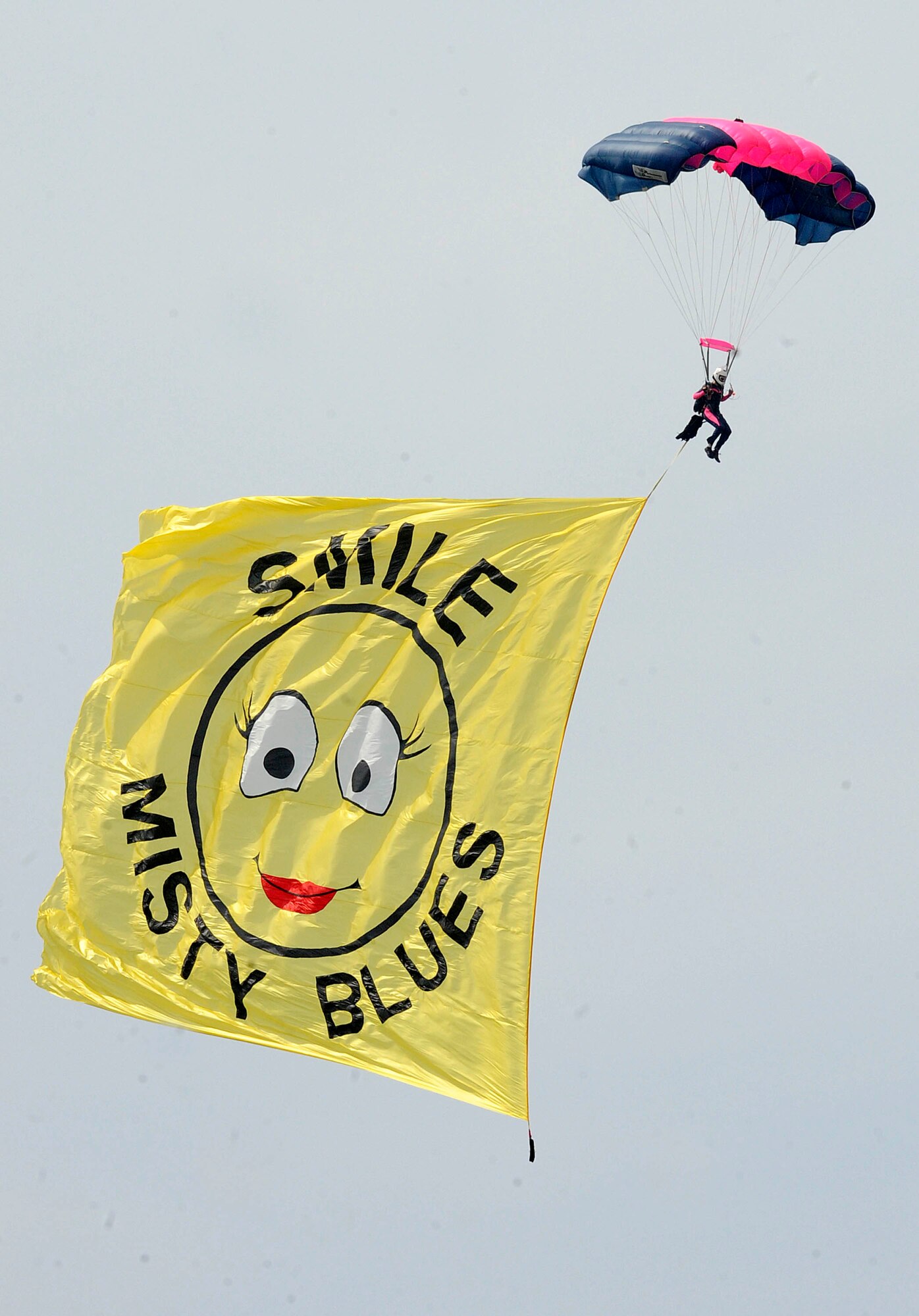 A skydiver with the Misty Blues All-Women Skydiving Team touches down after completing an aerial jump during the AirPower over Hampton Roads open house at Langley Air Force Base, Va., May 14, 2011. The open house is a free three-day event featuring aerial demonstrations by modern and historical military aircraft and civilian performers. (U.S. Air Force photo by Staff Sgt. Dana Hill)(RELEASED)