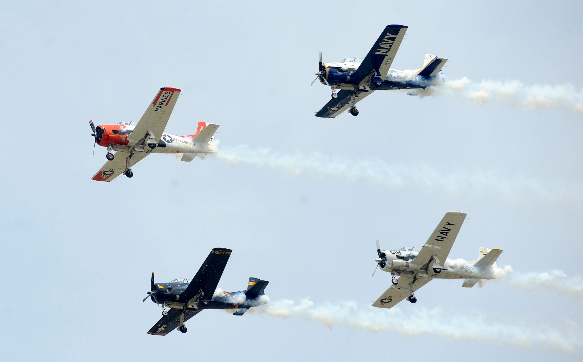 The Trojan Horsemen T-28 Warbirds Aerobatic Formation Demonstration Team performs aerial maneuvers during the AirPower over Hampton Roads open house at Langley Air Force Base, Va., May 14, 2011. The open house is a free three-day event featuring aerial demonstrations by modern and historical military aircraft and civilian performers. (U.S. Air Force photo by Staff Sgt. Dana Hill)(RELEASED)
