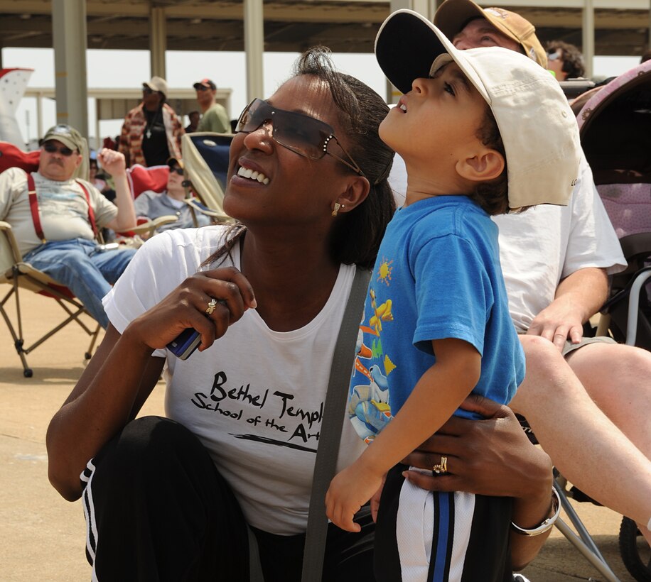 Dawn and Samuel Watts watch the Misty Blues All Women Skydiving Team during Joint Base Langley Eustis’ Air Power over Hampton Roads Open House at Langley Air Force Base, Va., May 14, 2011. The open house showcased the Air Force’s past and present capabilities in airpower.  (U.S. Air Force photo/Airman 1st Class Teresa Zimmerman)(RELEASED)