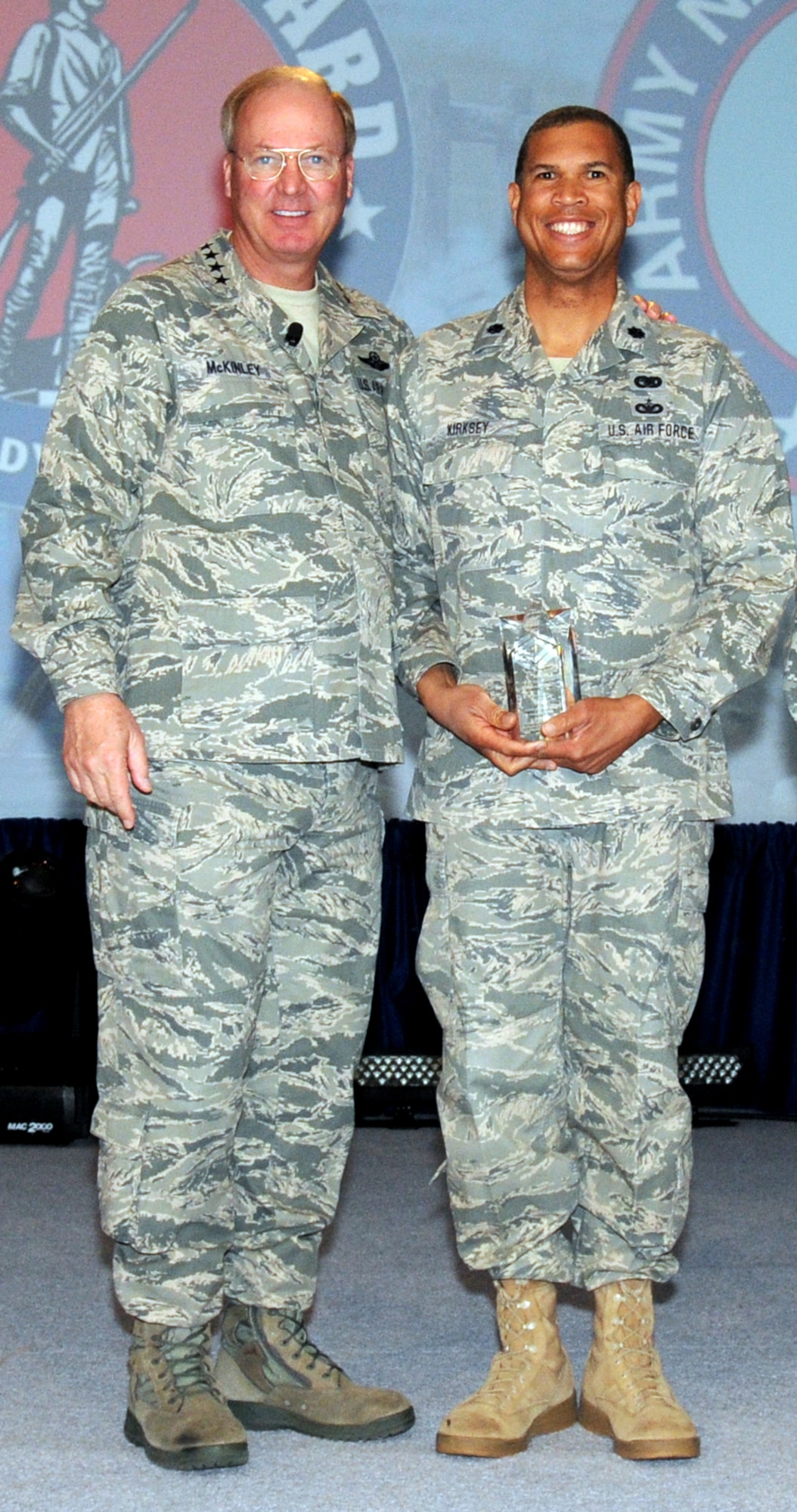 Gen. Craig R. McKinley, Chief, National Guard Bureau, presents Lt. Col. Allen Kirksey, 161st Logistics Readiness Squadron commander, the individual National Guard Bureau 2011 Excellence in Diversity Award. The Excellence in Diversity Award recognizes servicemembers who contribute to mission readiness and diversity initiatives that impact the National Guard, state and local community. (Courtesy Photo)