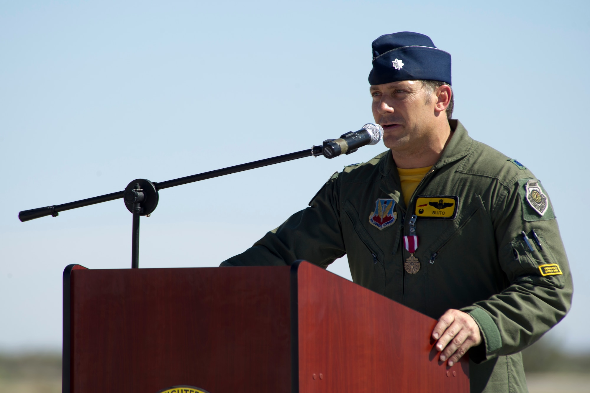 HOLLOMAN AIR FORCE BASE, N.M – Lt. Col. Craig Baker, 8th Fighter Squadron commander speaks about the squadron’s historic accomplishments and earned accolades, May  13, 2011, during the squadron’s inactivation ceremony. The 8th FS, known as the “Black Sheep,” was first activated in January 1941 and its mission and aircraft have transitioned several times to support the emerging needs of the Air Force. Starting with the P-40 Warhawk, the “Black Sheep” have led the way in fielding, flying and employing the Air Force’s newest air superiority aircraft. Currently flying the F-22 Raptor, the unit’s inactivation means that its Airman and aircraft will be relocated to other units on Holloman. The famed “Black Sheep”” patch, name, and colors will be maintained by Air Force historians for reactivation when needed. (U.S. Air Force photo by Tech Sgt. Joe Laws / Released)