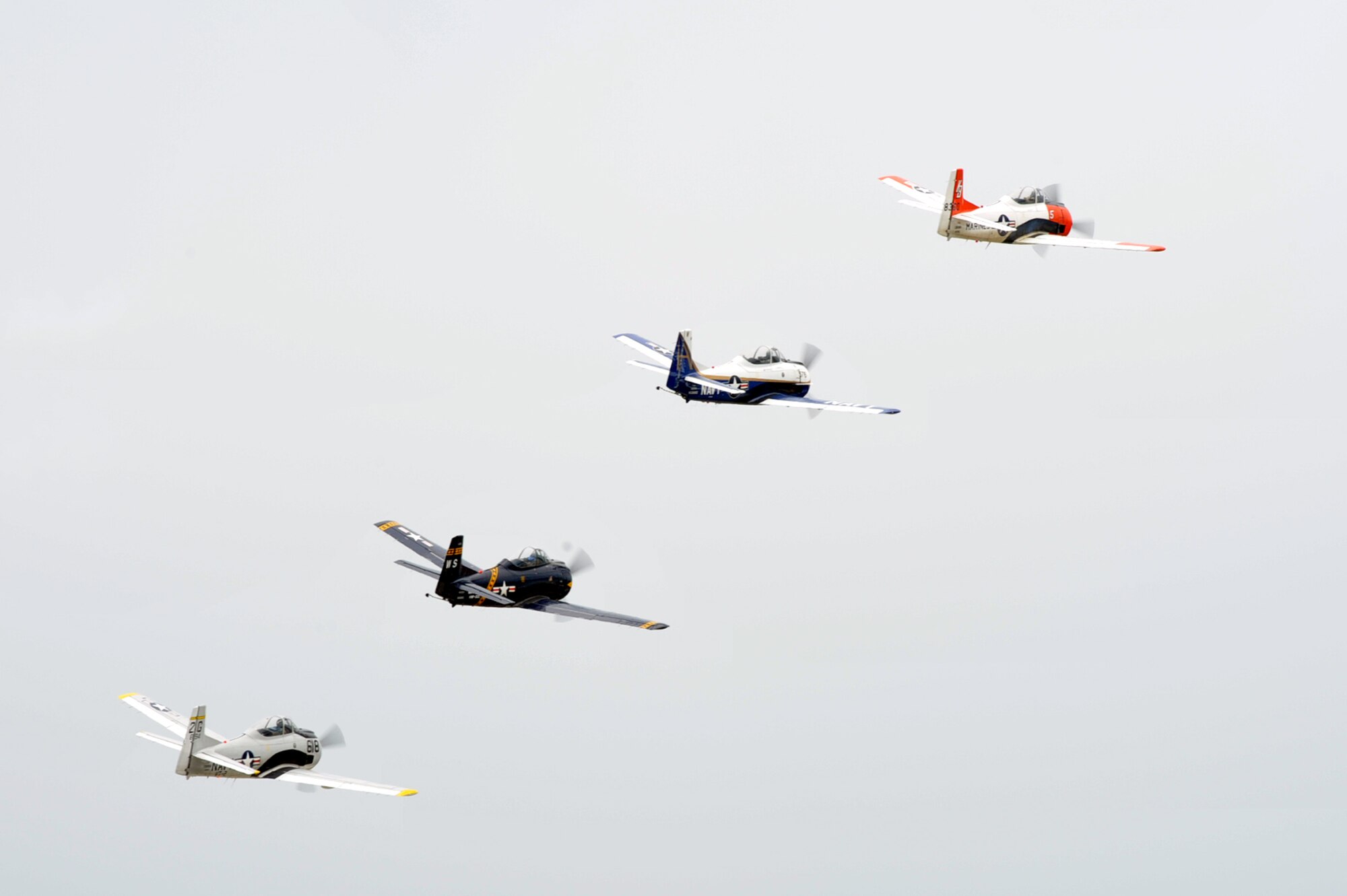 The Trojan Horsemen T-28 Warbirds Aerobatic Formation Demonstration Team flies in formation during an aerial demonstration at the AirPower over Hampton Roads open house at Langley Air Force Base, Va., May 13, 2011. The open house educates the public on past and present military aerial capabilities, increases recruiting, and shows appreciation to the local community. (U.S. Air Force photo by Airman 1st Class Camilla Griffin/RELEASED)
