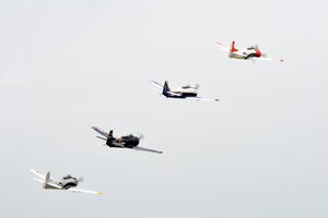 The Trojan Horsemen T-28 Warbirds Aerobatic Formation Demonstration Team flies in formation during an aerial demonstration at the AirPower over Hampton Roads open house at Langley Air Force Base, Va., May 13, 2011. The open house educates the public on past and present military aerial capabilities, increases recruiting, and shows appreciation to the local community. (U.S. Air Force photo by Airman 1st Class Camilla Griffin/RELEASED)