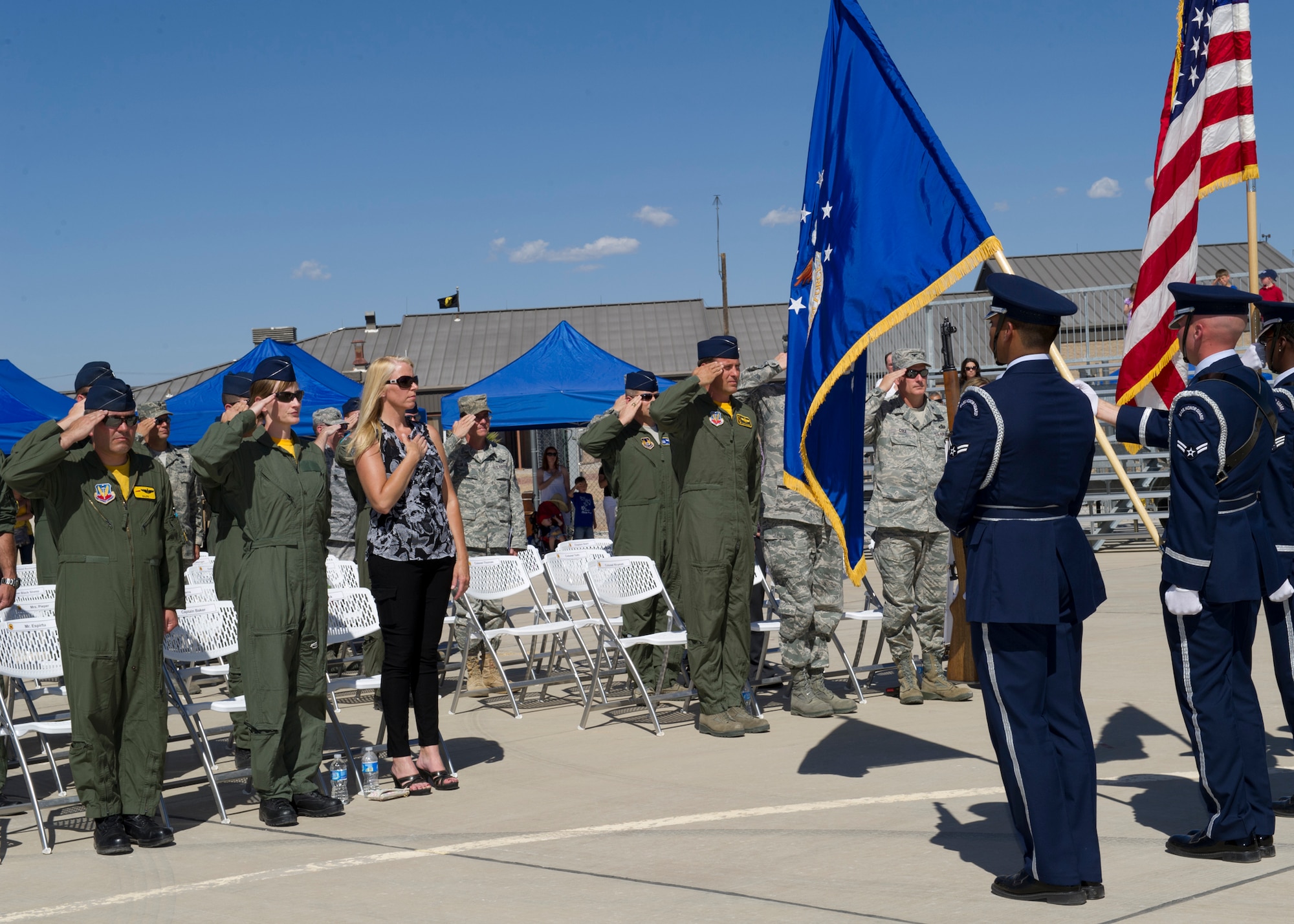 HOLLOMAN AIR FORCE BASE, N.M. -- The Holloman Air Force Base Honor Guard presents the colors, May 13, 2011, during the national anthem for the 8th Fighter Squadron inactivation ceremony. The 8th FS, known as the “Black Sheep”, was activated in January 1941 and its mission and aircraft have changed several times to support the needs of the Air Force. The inactivation means that the Airmen will be relocated to different units on Holloman. (U.S. Air Force photo by Airman 1st Class Eileen Payne/Released)