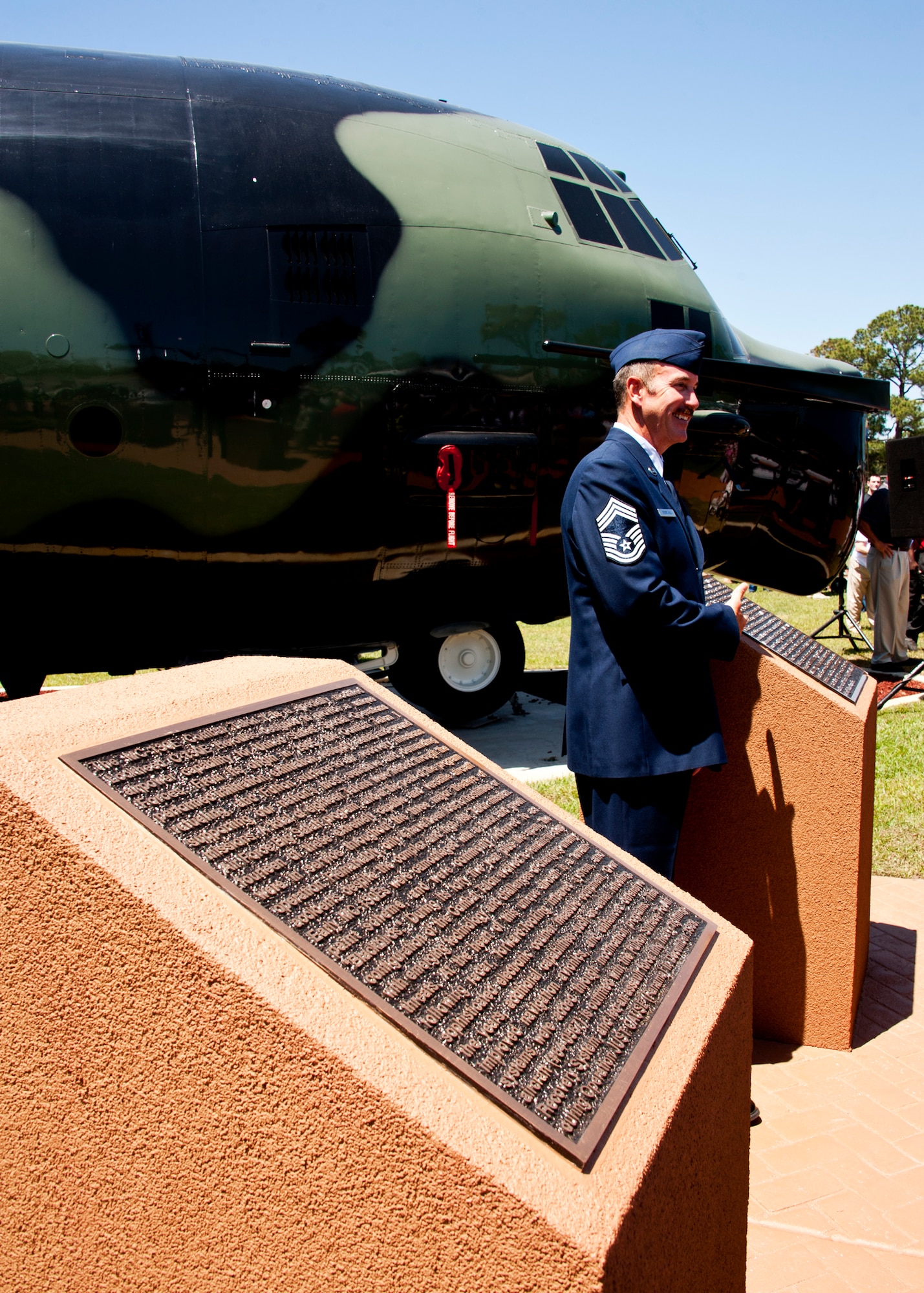 Chief Master Sgt. Dale Berryhill, 919th Operations Group, stands in front of the plaque and MC-130E Combat Talon I during the aircraft’s dedication at Hurlburt Field airpark May 6.  The Talon known as “Wild Thing” had a 46-year Air Force career and 22,336.5 flight hours.  (U.S. Air Force photo/Tech. Sgt. Samuel King Jr.)