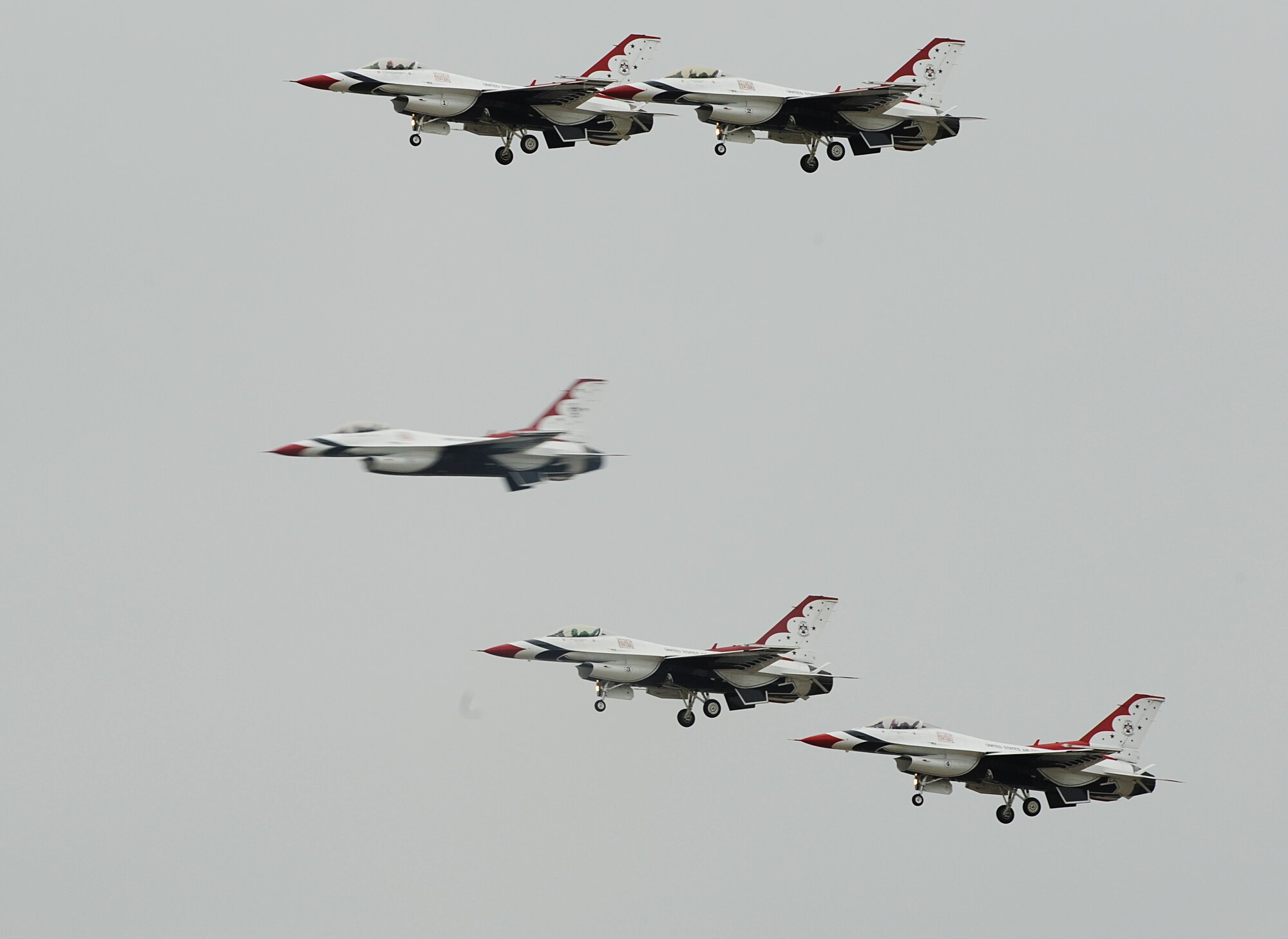 An F-16 Fighting Falcon Thunderbird speeds through a formation during Joint Base-Langley Eustis’ Air Power over Hampton Roads at Langley Air Force Base, Va., May 13, 2011. The U.S. Air Force Demonstration Squadron, the Thunderbirds, display the most advanced airpower and support capabilities in the world. (U.S. Air Force photo/Airman 1st Class Teresa Zimmerman)(RELEASED)