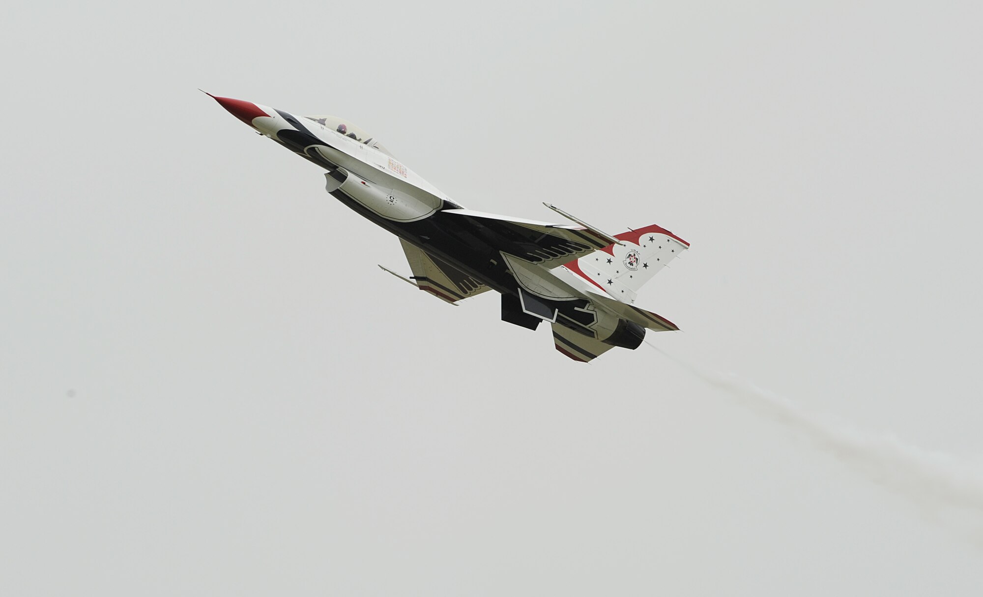 An F-16 Fighting Falcon Thunderbird sours to the clouds during Joint Base-Langley Eustis’ Air Power over Hampton Roads at Langley Air Force Base, Va., May 13, 2011. The U.S. Air Force Demonstration Squadron, the Thunderbirds, headlined the free open house with precision aerial maneuvers, demonstrating the capabilities of high performance aircraft to the Hampton Roads area. (U.S. Air Force photo/Airman 1st Class Teresa Zimmerman)(RELEASED)