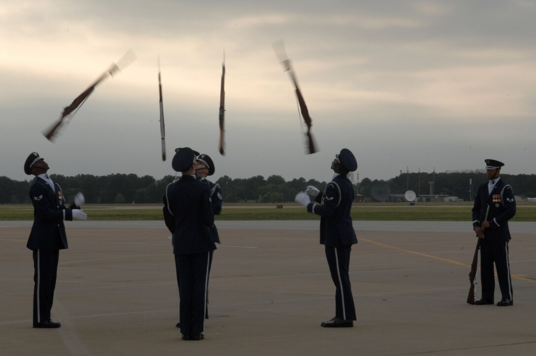 The Langley Honor Guard performs ceremonial rifle demonstrations at AirPower over Hampton Roads at Langley Air Force Base, Va., May 13, 2011. The free open house provides a venue in which the public can see modern and historical military aircraft in action. (U.S. Air Force photo by Airman 1st Class Racheal Watson)(RELEASED)