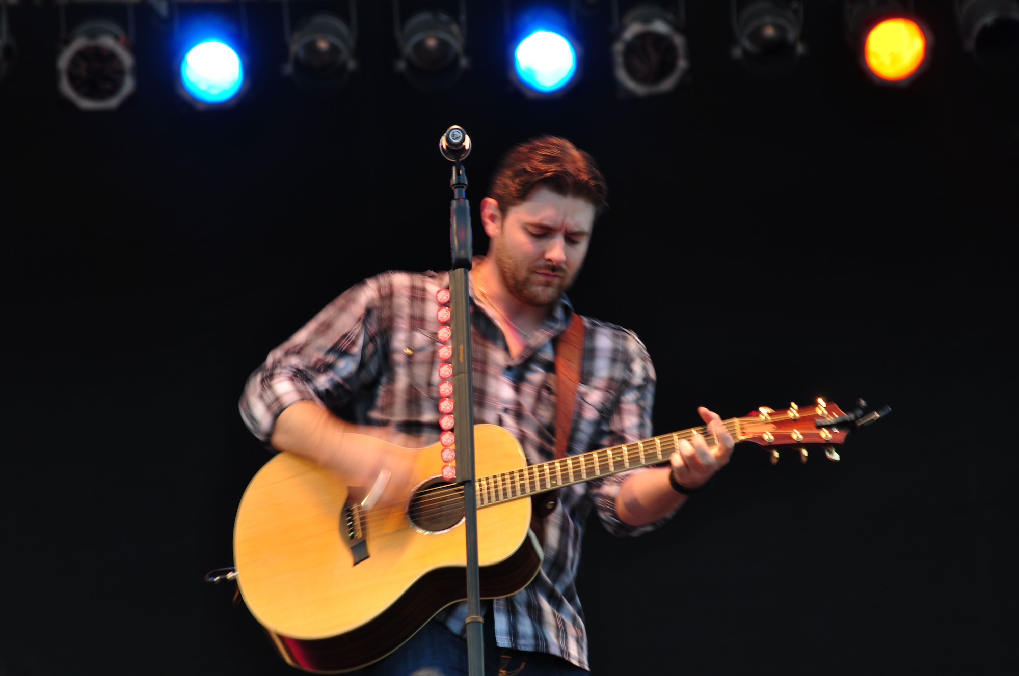 Chris Young, country singer, strums his guitar at Langley Air Force Base, Va., May 13, 2011. The free AirPower over Hampton Roads concert kicked off a night of fireworks and aerial demonstrations. (U.S. Air Force photo/Senior Airman Jonathan Muller)(RELEASED)