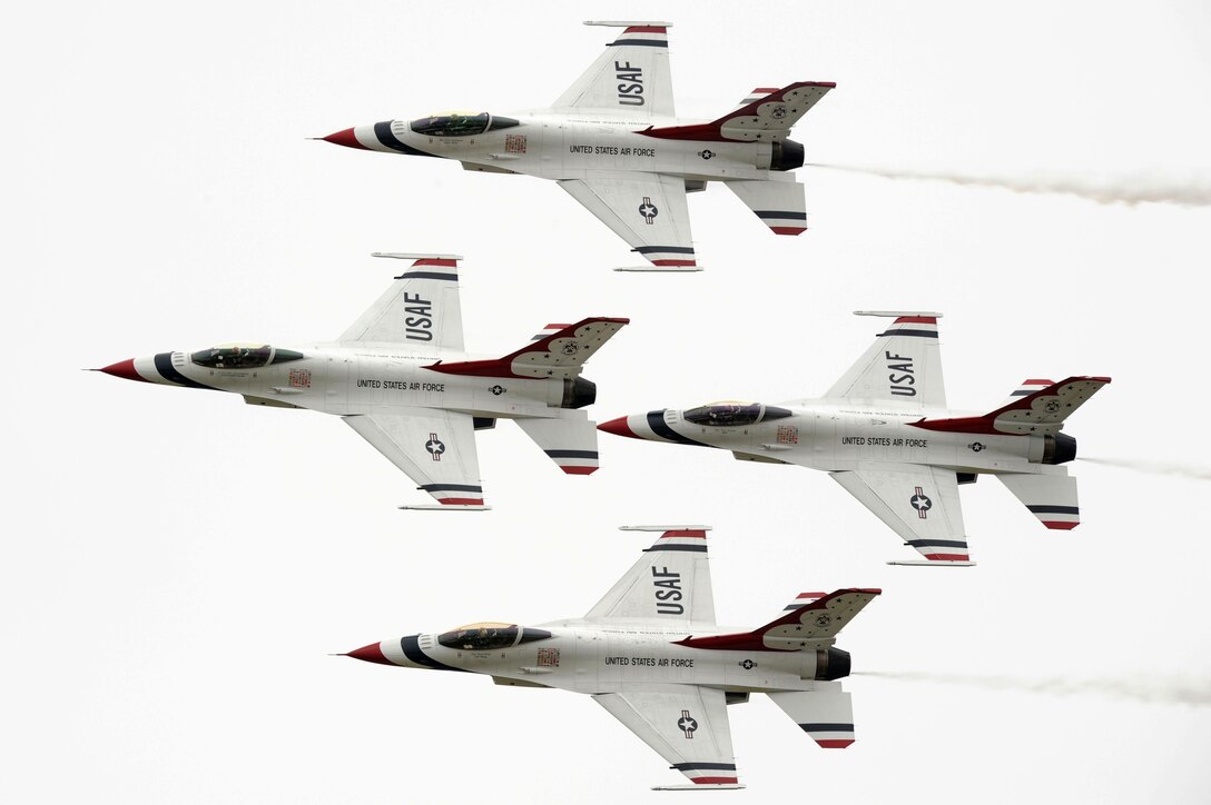 The U.S. Air Force Demonstration Squadron, the Thunderbirds, fly in a formation during Air Power over Hampton Roads at Langley Air Force Base, Va., May 13, 2011. The Thunderbirds headlined Joint the free open house with precision aerial maneuvers, demonstrating the capabilities of high performance aircraft to the Hampton Roads area.  (U.S. Air Force photo by Airman 1st Class Kayla Newman)(RELEASED)