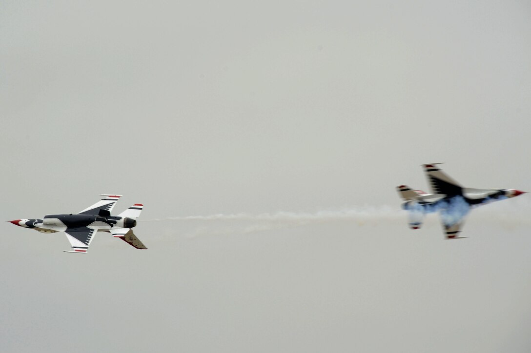The U.S. Air Force Demonstration Squadron, the Thunderbirds, perform a pass during an aerial demonstration at Langley Air Force Base, Va., May 13, 2011. The Thunderbirds headlined Joint Base Langley-Eustis’ Air Power over Hampton Roads free open house with precision aerial maneuvers, demonstrating the capabilities of high performance aircraft to the Hampton Roads area. (U.S. Air Force photo by Airman 1st Class Kayla Newman)(RELEASED)