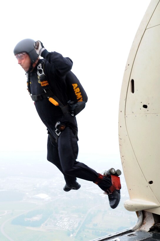 Army Sgt. 1st Class Tom Dunning, U.S. Army Golden Knights Parachute Team, parachutist, jumps from a C-31 aircraft during an aerial demonstration at Air Power over Hampton Roads at Langley Air Force Base, Va., May 13, 2011. The annual AirPower over Hampton Roads open house provides a free venue in which the public can see modern and historical military aircraft and civilian performers in action. (U.S. Air Force photo by Airman 1st Class Kayla Newman)(RELEASED)
