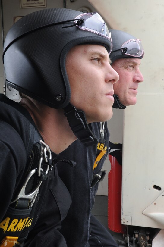 Army Spc. Jeshua Stahler and Sgt. 1st Class J.D. Berentis, U.S. Army Golden Knights Parachute Team, parachutists, visually check the weather conditions prior to jumping at Langley Air Force Base, Va., May 13, 2011 at AirPower over Hampton Roads. The United States Army Parachute Team was formed in 1959 by 19 “Airborne” Soldiers from various military units. (U.S. Air Force photo by Airman 1st Class Kayla Newman)(RELEASED)