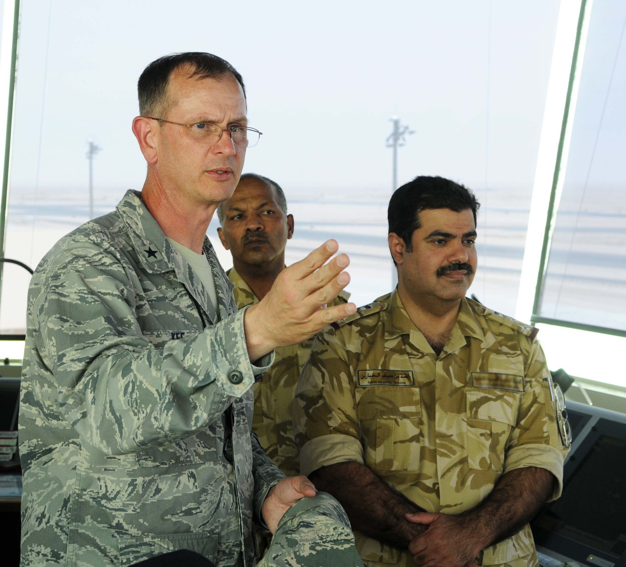 Brig. Gen. Randy Kee, 379th Air Expeditionary Wing commander, talks with Host Nation servicemembers in May 12 in Southwest Asia.  (U.S. Air Force photo/ Staff Sgt Anthony Graham)