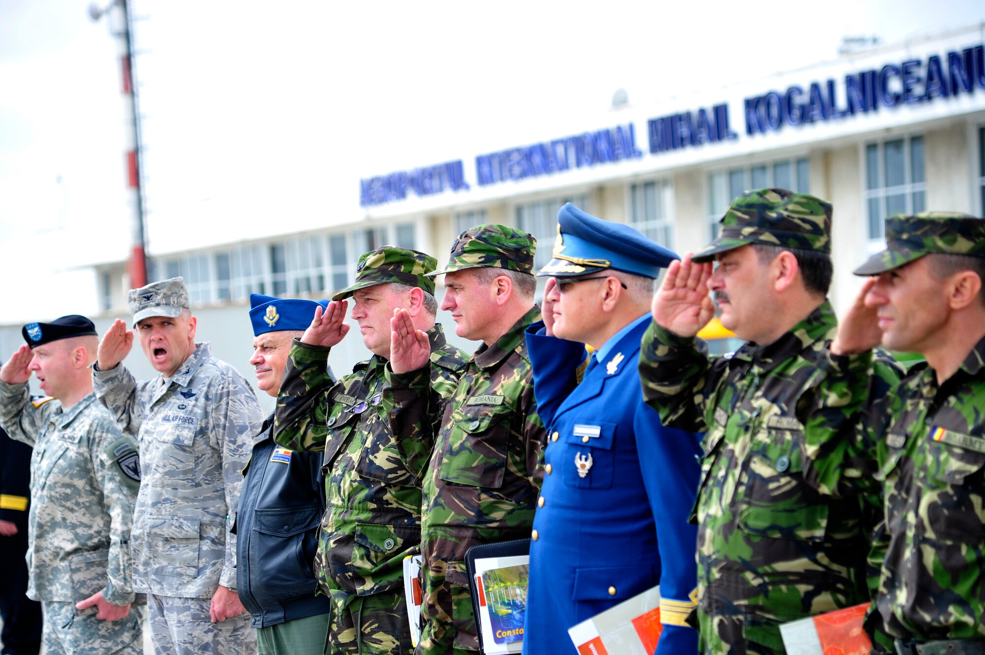 Col. John Roscoe 385th Air Expeditionary Group commander gives the command of 'order arms' to U.S. and Romanian military officials as Gen. Duncan McNabb, U.S. Transportation Command commander departs Mihail Kogalniceanu Air Base, Romania after a visit there May 12.  While in Romania, General McNabb visited both Mihail Kogalniceanu airport and the Port of Constanta.  USTRANSCOM is evaluating the feasibility of using the airport and seaport as a multi-modal hub for equipment flowing into and out of the U.S. Central Command theater of operation.  (U.S. Air Force photo by Master Sgt. Laura K. Deckman/released)