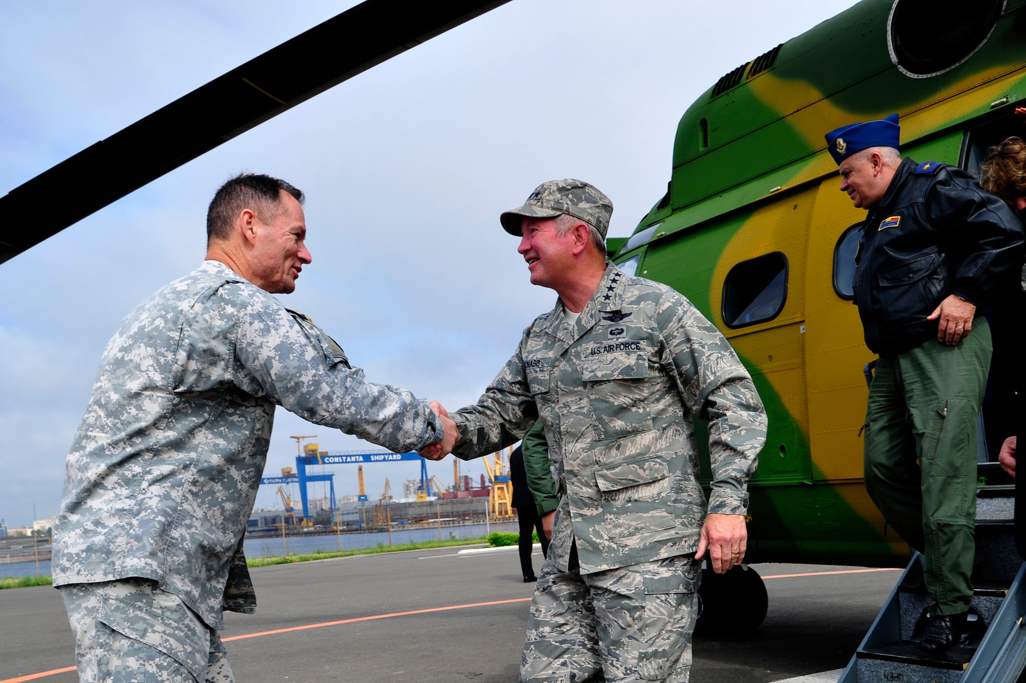 Air Force Gen. Duncan McNabb, U.S. Transportation Command commander is greeted by Army Col. Bill Moseley, 598th Transportation Brigade commander at the Port of Constanta, Romania, May 12. While in Romania, General McNabb visited both Mihail Kogalniceanu airport and the Port of Constanta.  USTRANSCOM is evaluating the feasibility of using the airport and seaport as a multi-modal hub for equipment flowing into and out of the U.S. Central Command theater of operation.  (U.S. Air Force photo by Master Sgt. Laura K. Deckman/released)
