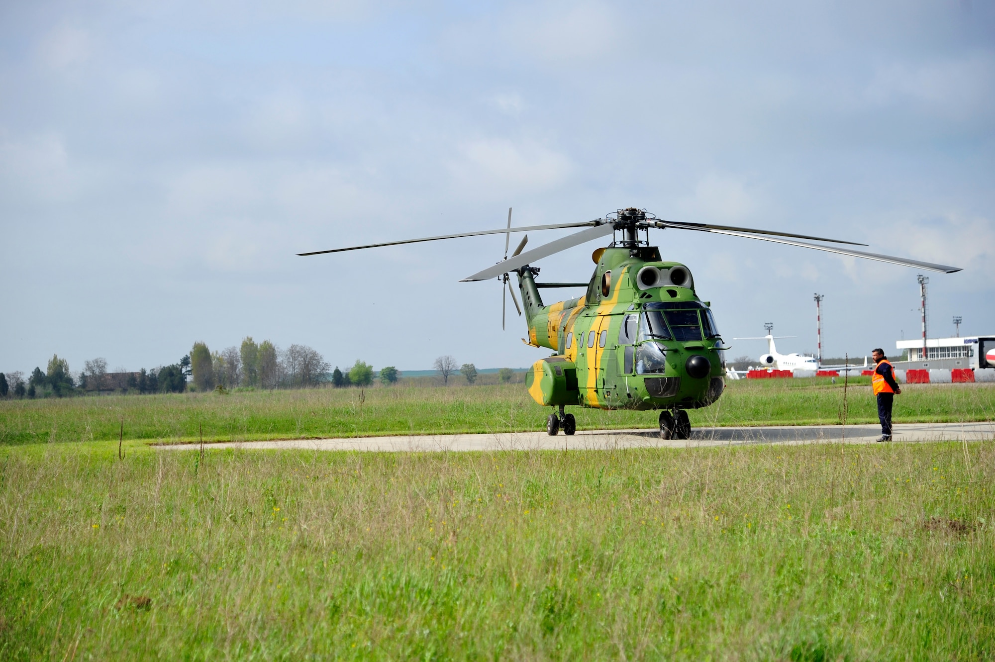 A Romanian air force Puma helicopter prepares to take flight at Mihail Kogalniceanu Air Base, Romania with Gen. Duncan McNabb, U.S. Transportation Command commander on board, May 12. While in Romania, General McNabb visited both Mihail Kogalniceanu airport and the Port of Constanta.  USTRANSCOM is evaluating the feasibility of using the airport and seaport as a multi-modal hub for equipment flowing into and out of the U.S. Central Command theater of operation.  (U.S. Air Force photo by Master Sgt. Laura K. Deckman/released)