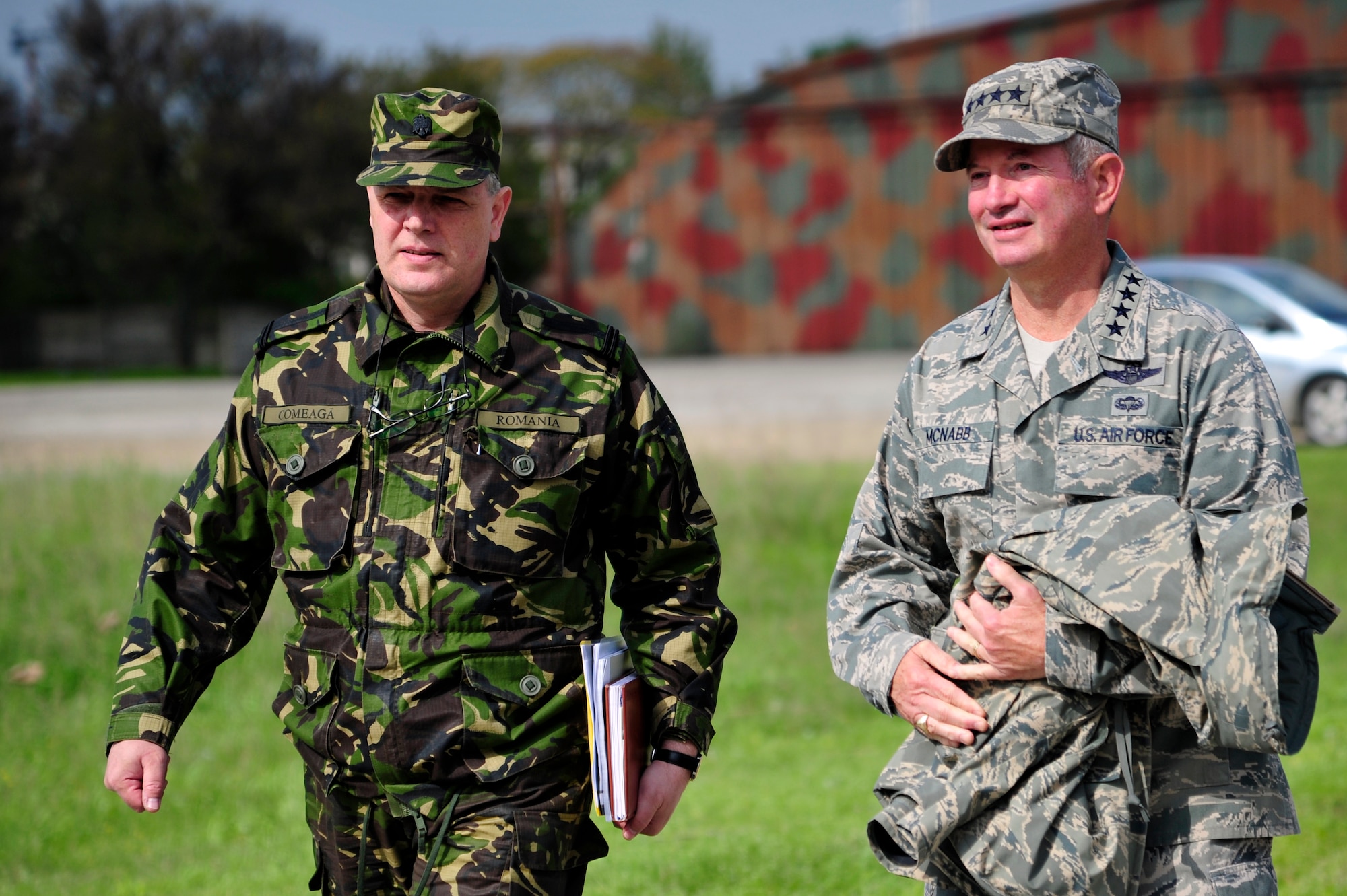Lt. Col. Cornel Comeaga, Romanian land force civil engineer escorts Gen. Duncan McNabb, U.S. Transportation Command commander to a Romanian air force Puma helicopter during a tour of Mihail Kogalniceanu Air Base, Romania, May 12.  While in
Romania, General McNabb visited both Mihail Kogalniceanu airport and the
Port of Constanta.  USTRANSCOM is evaluating the feasibility of using the
airport and seaport as a multi-modal hub for equipment flowing into and out
of the U.S. Central Command theater of operation.  (U.S. Air Force photo by
Master Sgt. Laura K. Deckman/released)