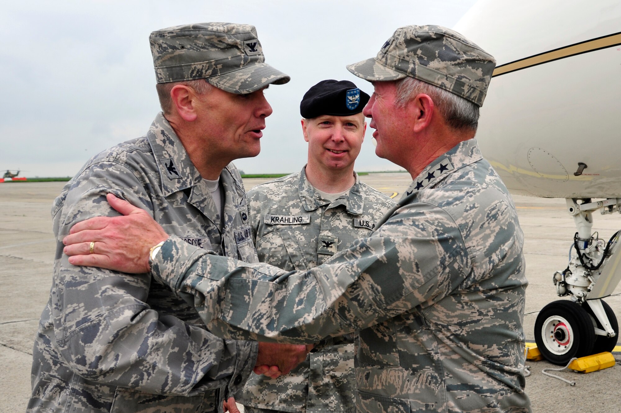 Col. John Roscoe 385th Air Expeditionary Group commander greets Gen. Duncan McNabb, U.S. Transportation Command commander at Mihail Kogalniceanu Air Base, Romania, May 12.  While in Romania, General McNabb visited both Mihail Kogalniceanu airport and the Port of Constanta.  USTRANSCOM is evaluating the feasibility of using the airport and seaport as a multi-modal hub for equipment flowing into and out of the U.S. Central Command theater of operation.  (U.S. Air Force photo by Master Sgt. Laura K. Deckman/released)