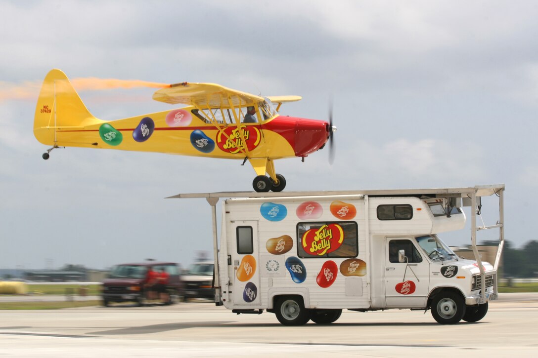 Kent Pietsch attempts to land the Jelly Belly 1942 Interstate Cadet onto the top of an RV during the 2011 Sounds of Freedom Air Show aboard Marine Corps Air Station New River, May 15.  Pietsch also flew a comedy routine in which parts of the plane and a roll of toilet paper fell from his aircraft.  About 30,000 guests visited the airshow to celebrate the centennial of naval aviation.