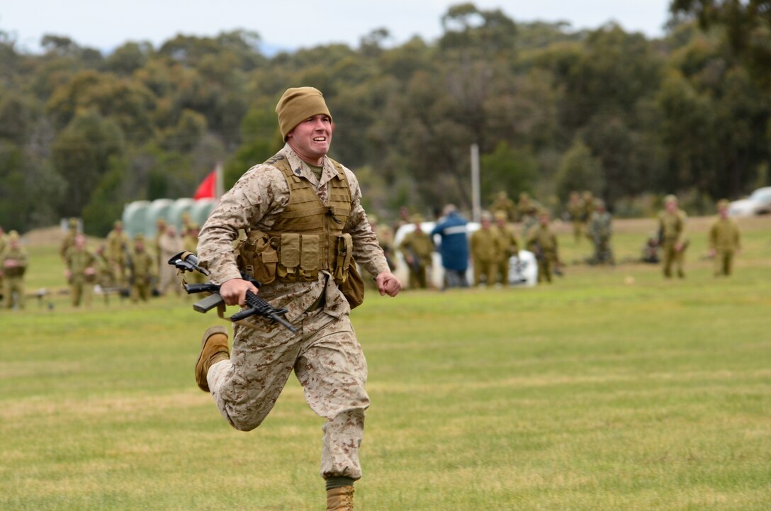 Sgt. Joshua Martin, competitor, Combat Shooting Team, Weapons Training Battalion, Marine Corps Base Quantico, runs to the firing point during a timed match May 15 at the 2011 Australian Army Skill at Arms Meeting.  The meeting is an annual, international combat-marksmanship competition hosted by the Australian Army that will run through May 19.  (U.S. Marine Corps Photo by Lance Cpl. Mark W. Stroud/Released)