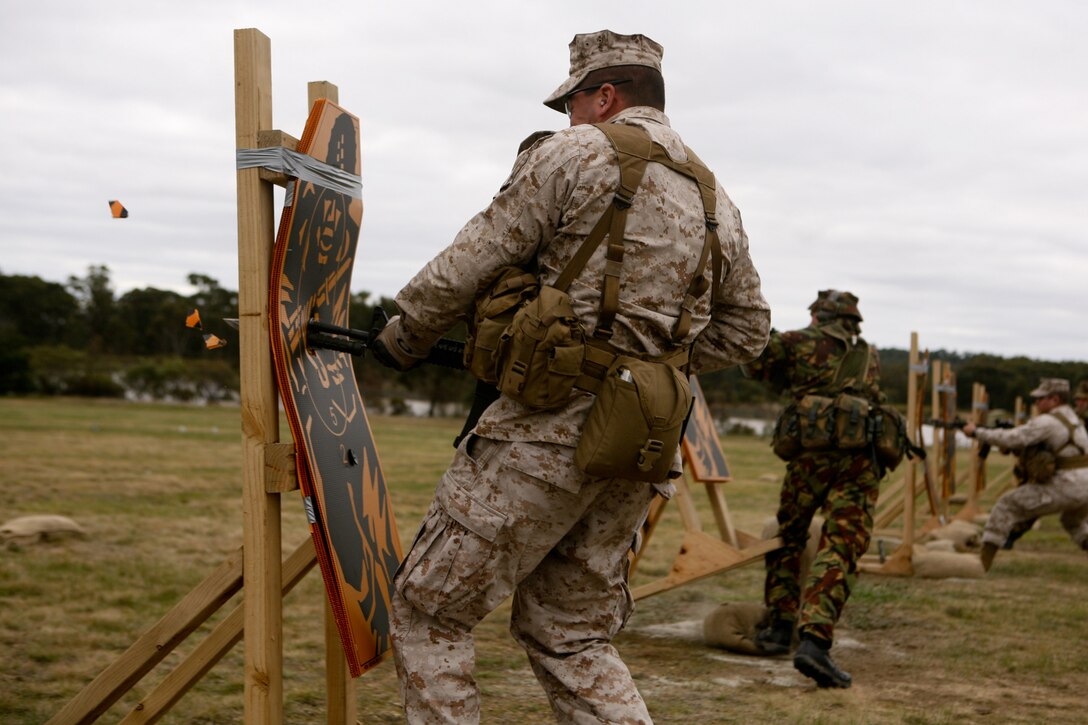 Sgt. Jonathan Shue, noncommissioned officer-in-charge, machine shop, Marine Aviation Logistics Group 36, Marine Aircraft Group 36, 1st Marine Aircraft Wing, III Marine Expeditionary Force, bayonets a target here May 15 during the 2011 Australian Army Skill at Arms Meeting. “From a Marine’s standpoint, a bayonet charge is nothing more than absolute aggression,” said Shue. The week-long meeting pit military representatives from partner nations in competition in a series of grueling combat marksmanship events. Represented nations include Canada, France (French Forces New Caledonia), Indonesia, Timor Leste, Brunei, Netherlands, U.S., Papua New Guinea, New Zealand, Singapore, Malaysia, Thailand as well as a contingent of Japanese observers. (U.S. Marine Corps Photo by Lance Cpl. Mark W. Stroud/Released)