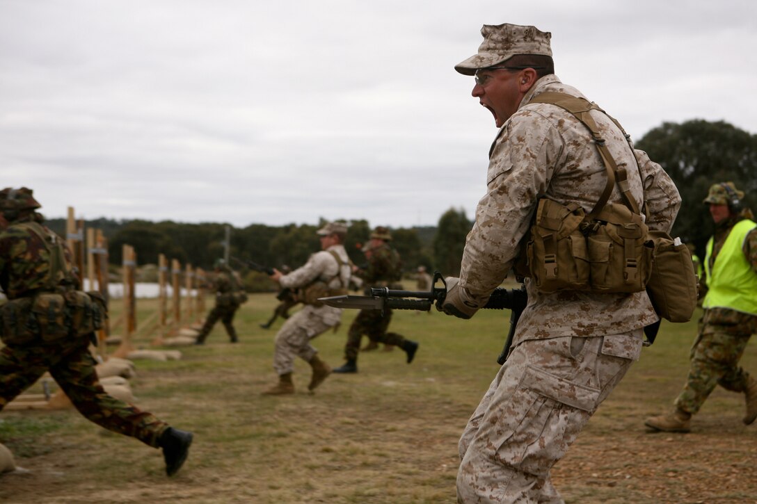 Sgt. Jonathan Shue, noncommissioned officer-in-charge, machine shop, Marine Aviation Logistics Squadron 36, Marine Aircraft Group 36, 1st Marine Aircraft Wing, III Marine Expeditionary Force, preparers to bayonet a target here May 15 during the 2011 Australian Army Skill at Arms Meeting. “There is nothing that a Marine wants to hear more than ‘fix bayonets’ and nothing that the enemy fears more,” said Shue. The week-long meeting pit military representatives from partner nations in competition in a series of grueling combat marksmanship events. Represented nations include Canada, France (French Forces New Caledonia), Indonesia, Timor Leste, Brunei, Netherlands, U.S., Papua New Guinea, New Zealand, Singapore, Malaysia, Thailand as well as a contingent of Japanese observers. (U.S. Marine Corps Photo by Lance Cpl. Mark W. Stroud/Released)