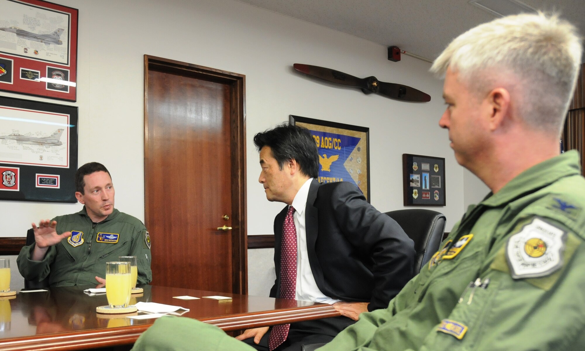 MISAWA AIR BASE, Japan -- Mr. Katsuya Okada, the Secretary-General for The Democratic Party of Japan, receives a briefing from Col. Michael Rothstein, 35th Fighter Wing commander, and Col. Al Wimmer, 35th Fighter Wing vice commander, May 14. Mr. Okada met with the colonels to learn about the 35th Fighter Wing mission and Misawa Air Base’s support to Operation Tomodachi. (U.S. Air Force photo/Staff Sgt. Rachel Martinez)