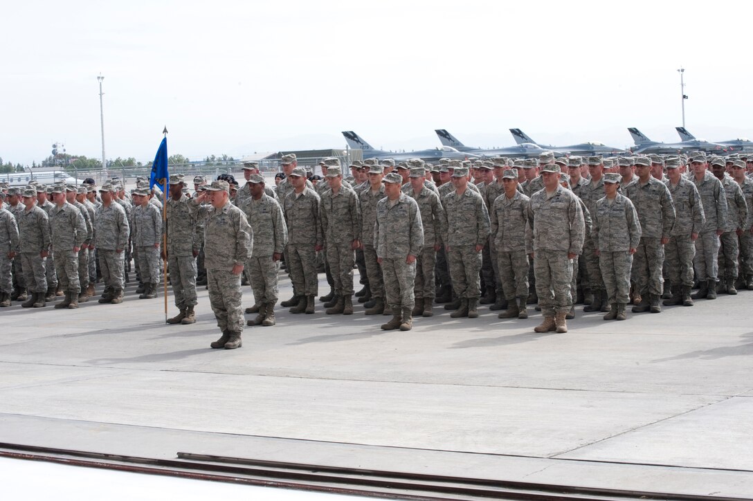 Members of the 144th Fighter Wing, California Air National Guard, come to attention during the recent Change of Command Ceremony held in Fresno, Calif. on May 14, 2011.  The ceremony allows the unit to witness their new leader, Col. Sami D. Said, assume his dutiful position as the Wing Commander.  (U.S. Air force photo by Master Sgt. David Loeffler/released)